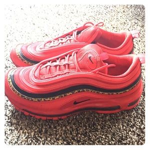 Nike sneakers/ tennis shoes. Red and cheetah print